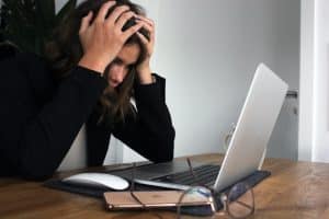 Girl in front of computer exhausted wants to quit